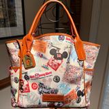 Dooney & Bourke Bags | Dooney & Bourke Walt Disney World 4 Park Icons Tote Satchel Travel Bag | Color: Brown/Cream | Size: 13” X 16” X 6”