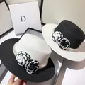 Chapeau haut de forme plat pour femme paille tissée noir et blanc sauvage fleur vent soleil