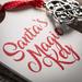 The Holiday Aisle® Santa's Magic Key Holiday Shaped Ornament Wood in Brown/Gray/Red | 10.25 H x 4 W x 0.25 D in | Wayfair