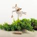 The Holiday Aisle® Flying Angel Holding a Star on a Wooden Base Figurine Wood in Brown | 10.75 H x 5.25 W x 1.75 D in | Wayfair