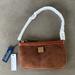 Dooney & Bourke Bags | Dooney And Bourke Brown Large Slim Wristlet | Color: Brown | Size: Os