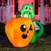 The Holiday Aisle® Dino Biting on Pumpkin Inflatable in Green/Orange | 60 H x 48 W x 21 D in | Wayfair D167B5D9837346099BB9D312435C8791