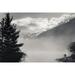 Silhouette of a photographer on the shore of Lake Louise with fog rising from the lake at sunrise Banff National Park; Lake Louise Alberta Canada Poster Print by Aaron Von Hagen / Design Pics