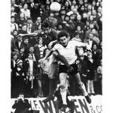 England: Soccer Match. /Njim Giles (Left) Of Charleston Fc And Ian Porterfield Of Sunderland Fc Jump For The Ball During A Soccer Match 15 November 1975. Poster Print by Granger Collection