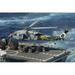 Pacific Ocean September 19 2012 - An MH-60S Sea Hawk helicopter picks up supplies from the Military Sealift Command fast combat support ship USNS Bridge. Poster Print (34 x 22)