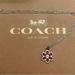 Coach Jewelry | Coach Red Enamel Signature Flower Pendant .925 Sterling Silver Necklace | Color: Red/Silver | Size: Measures 18”-20” In Length