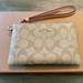 Coach Bags | Coach Corner Zip Wristlet In Signature Canvas | Color: Cream/Tan | Size: Measures: 6 1/4" (L) X 4" (H) X 1/2" (W)