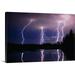 Great BIG Canvas | Lightning Storm Over A Lake Canvas Wall Art - 36x24