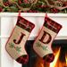 The Holiday Aisle® Christmas Personalized T Letter Stocking Cotton/Burlap/Jute in Brown/Green/Red | 10 H x 16 W in | Wayfair