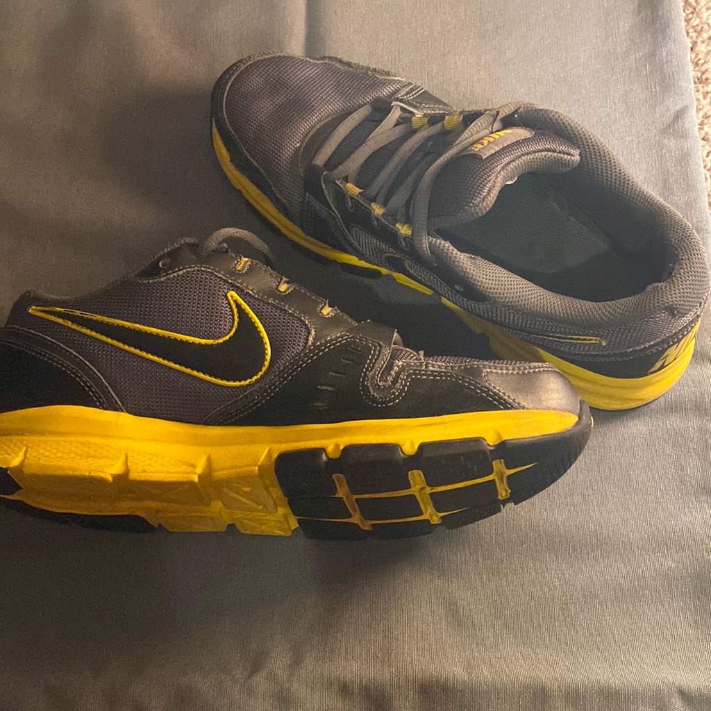 Nike Shoes | Gray And Yellow Men’s Nike Shoes. Small Stain On Front Of Right Shoe. | Color: Black/Gold | Size: 9