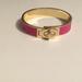 Coach Jewelry | Coach Leather Turn Lock Hinges Bangle | Color: Gold/Pink | Size: Os