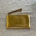 Michael Kors Bags | Michael Kors Gold Snakeskin Zipper Clutch Bag | Color: Gold | Size: Os