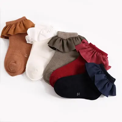 Chaussettes antidérapantes pour bébés filles en coton mignonnes de couleur unie en dentelle de