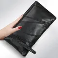Pochette à fermeture éclair en cuir PU pour femmes portefeuille sac à main sac d'argent simple