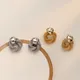 Boucles d'oreilles à tige de fleurs tressées en métal doré bijoux minimalistes boucle d'oreille