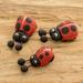 Rosalind Wheeler Handmade Ladybug Family Ceramic Figurine Wood in Brown/Red | 0.3 H x 0.5 W x 1 D in | Wayfair 159865E3C6E7471E82D497E331C1D05D