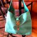 Dooney & Bourke Bags | Dooney Bourke Bucket Handbag..Beautiful Turquoise Color. | Color: Gold | Size: 14 In Wide And 12 Ins Tall