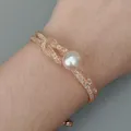 Bracelet boucle plaqué or rose 10mm perle d'eau douce