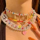 Collier de perles irrégulier avec pendentif en forme de lettre arc-en-ciel pour femmes style