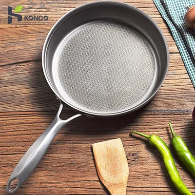Poêle à frire antiarina en accent d'abeille en titane wok chinois adaptée pour cuisinière à gaz et