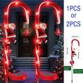 Solar Christmas Decorating Candy cane light Solar Christmas aisle marker light Snowflake and Santa s outdoor decorating post Constant and flash mode 8 LED lights for garden yard lawn 2PCS