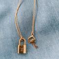 Louis Vuitton Jewelry | Louis Vuitton Lock Charm Necklace | Color: Gold | Size: Os