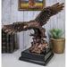 Millwood Pines Solok Bald Eagle Swooping Down w/ Open Wings Towards Open Water Figurine Resin | 12 H x 14.75 W x 8 D in | Wayfair