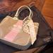 Coach Bags | Authentic Coach . Like New , Great Condition. Has Matching Scarf Tie On It. | Color: Cream/Pink | Size: Os