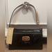 Michael Kors Bags | Michael Kors Wristlet - Black Shiny With Mk Logos - Bnwt | Color: Black/Tan | Size: Os