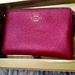 Coach Bags | Bnwt Coach Wristlet W/ Charms | Color: Gold/Pink | Size: 6in X 4in. W/ 6in Leather Strap