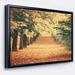 DESIGN ART Designart Autumn Forest with Walking Path Modern Forest Framed Canvas Wall Art 20 in. wide x 12 in. high