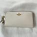 Coach Bags | Coach Wristlet. Soft White With Black Interior. Slots For 6 Cards. Zipper Pocket | Color: White | Size: 7” X 4”