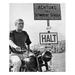 Steve Mcqueen Sitting on Motorcycle Parked Near Road Sign - Unframed Photograph Paper in Black/White Globe Photos Entertainment & Media | Wayfair