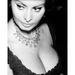 Sophia Loren displays her ample charms in black dress looks to side 8x10 photo