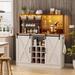 Gracie Oaks Viny Farmhouse Wine Coffee Bar Cabinet w/ LED Lights, Sliding Barn Door, Outlet & Glass Rack Wood in Brown/White | Wayfair