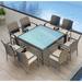 Wade Logan® Suffern Square 4 - Person Long Outdoor Dining Set w/ Cushions Glass, Wicker in Blue/Gray | 29.5 H x 39.5 W x 39.5 D in | Wayfair