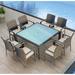 Wade Logan® Suffern Square 4 - Person Long Outdoor Dining Set w/ Cushions Glass, Wicker in Blue/Gray | 29.5" H x 59" W x 59" L | Wayfair