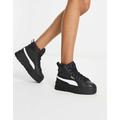 Puma Mayze Mid chunky trainers in black and gold