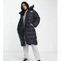 The North Face Acamarachi oversized long puffer coat in black Exclusive at ASOS