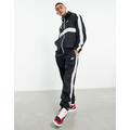 Nike Club woven tracksuit in black with side stripe
