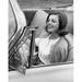 Close-Up of a Young Woman Sitting in a Car & Smiling Poster Print - 18 x 24 in.