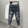 Strappato strappato con stampa Jeans per uomo pantaloni con fori grafici rotti Casual Soft Kpop
