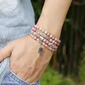 6mm Natürliche Rhodochrosit Perlen Strang Armband Frauen Lotus OM Buddha Charme Yoga Armband 108