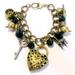 Disney Jewelry | Disney Brass Tone Black Bead Alice In Wonderland Themed Charm Bracelet | Color: Black/Gold | Size: Os