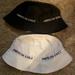 American Eagle Outfitters Accessories | 2 American Eagle Bucket Hats (With Logo)One Black One White. Euc | Color: Black/White | Size: Os