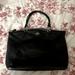 Coach Bags | Coach Handbag-Black Bag W/ Gold Zipper & Buckles. Great Condition. | Color: Black | Size: Os