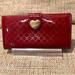 Gucci Bags | Gucci Guccissma Wine Patent Leather Continental Bifold Wallet Gold Heart Lock | Color: Gold/Red | Size: Os
