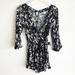 Free People Pants & Jumpsuits | Free People Xs All The Right Ruffles Romper Black Floral Print Wrap Boho | Color: Black | Size: Xs