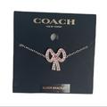 Coach Jewelry | Coach Antique Pave Bow Slider Bracelet, Gold Tone, Pink | Color: Pink/Silver | Size: Os
