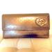 Gucci Accessories | Last Chance! 24-Hour Sale!Gucci Metallic Long Patent Leather Wallet Gold Heart | Color: Gold/Tan | Size: Os